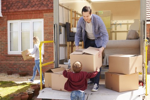 Professional man with van in Eelpieisland handling item collection carefully