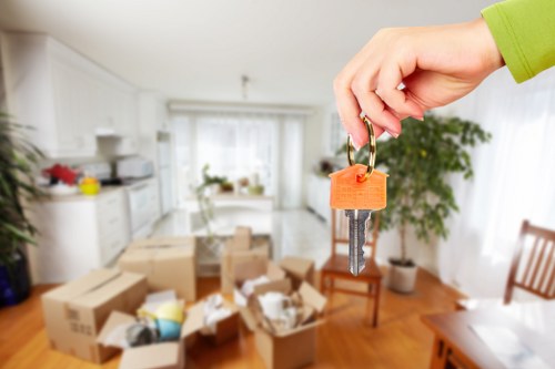 Safety-focused moving team using proper lifting techniques