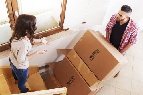 Professional movers handling furniture and household items during a move