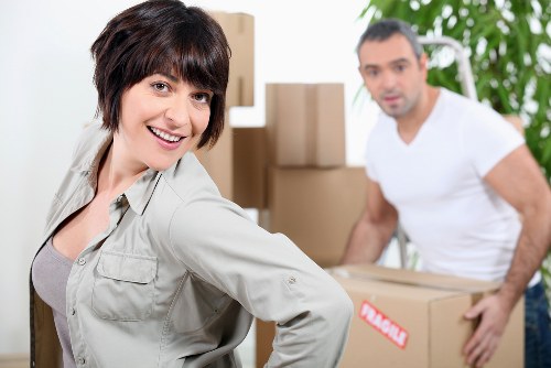 Removalists loading furniture and boxes for a home relocation