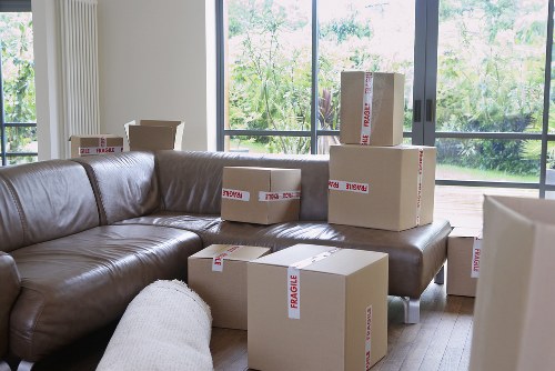 Local removals team loading boxes and furniture for transport